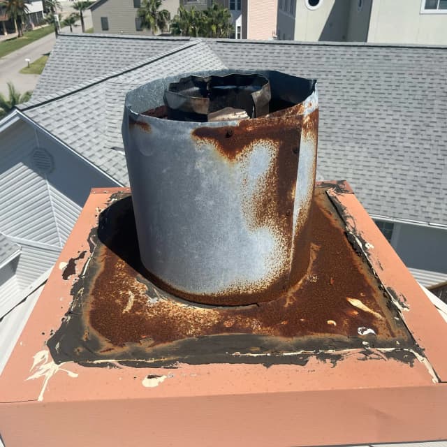 Missing or damaged chimney crown requiring cap installation